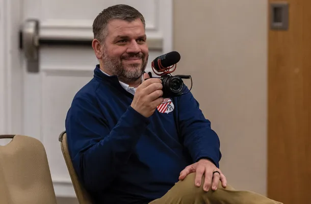 Nate Naasz holding a camera